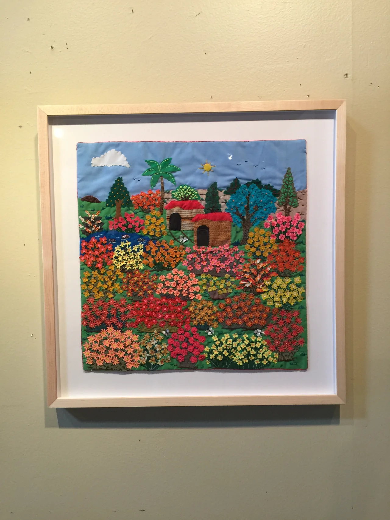 Colorful needlework in a white frame