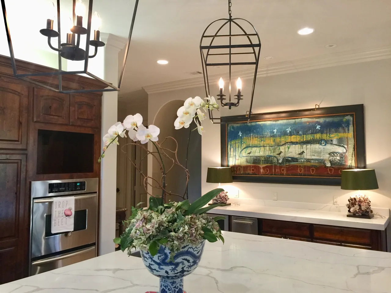 Framed art installed in a warm kitchen