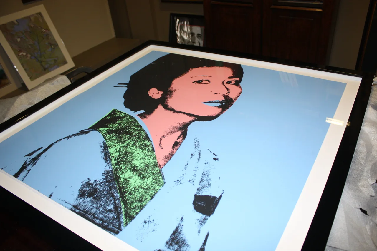 Portrait artwork being prepared for framing