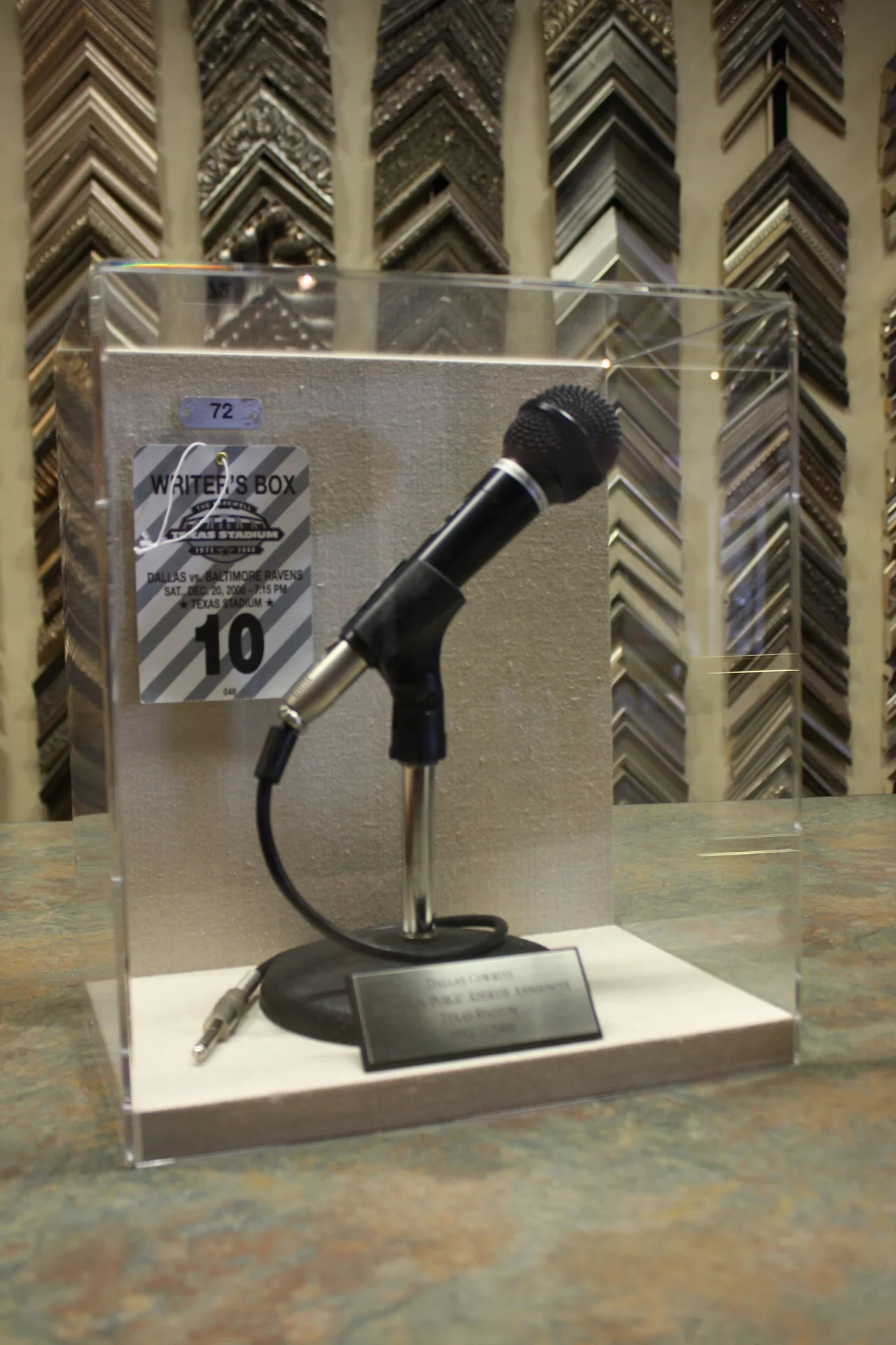 A microphone displayed in a custom shadow box