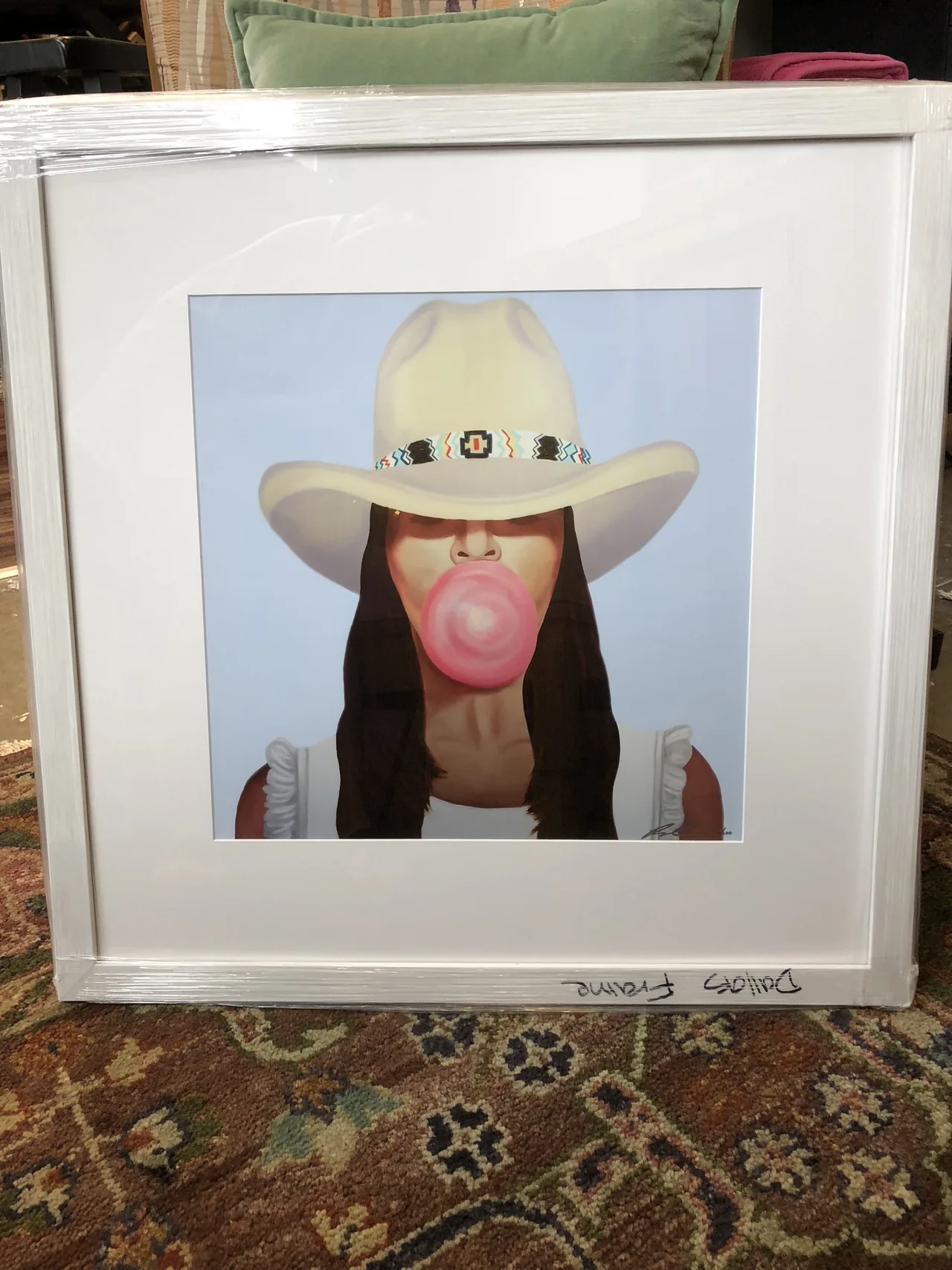 Whimsical portrait in a square white frame